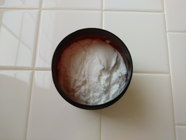 Settled Spooned Lotion in Container